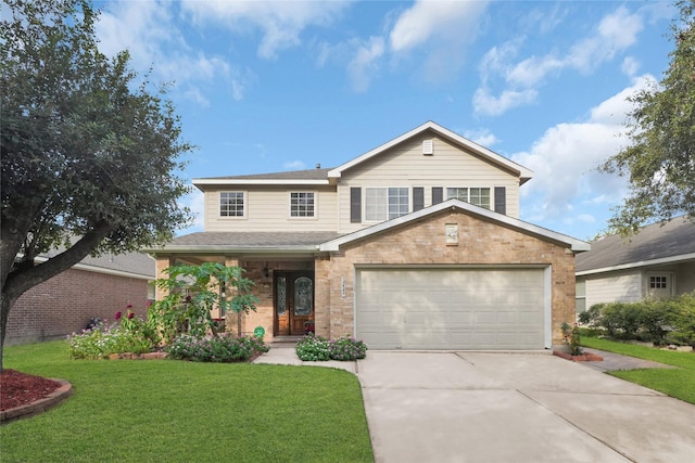 view of front property featuring a garage and a front yard