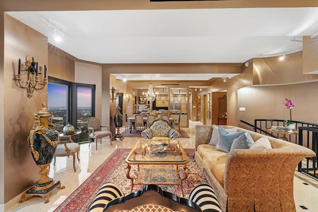 living room with a chandelier, light tile patterned floors, and crown molding