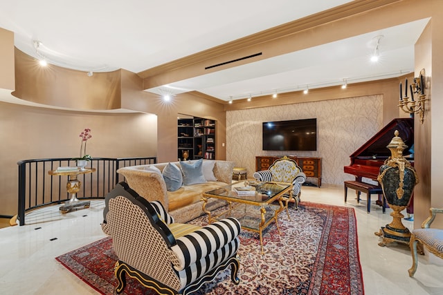 living room with ornamental molding and track lighting