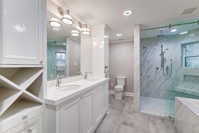 bathroom with a stall shower, visible vents, and a sink