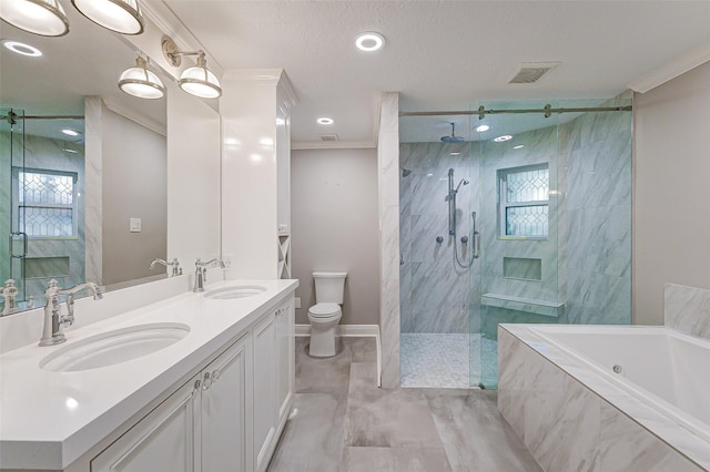 bathroom with ornamental molding, a sink, a bath, and a shower stall