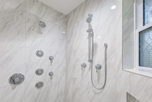 bathroom with tiled shower