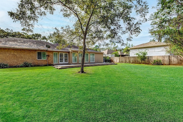 exterior space with french doors and fence