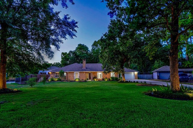 view of yard at dusk