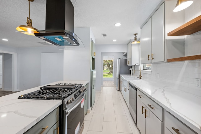 kitchen with extractor fan, stainless steel appliances, a textured ceiling, and light stone countertops