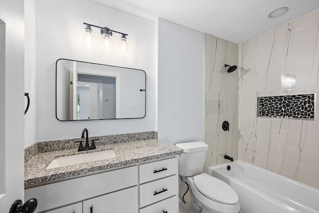 full bathroom with toilet, tiled shower / bath combo, vanity, and a textured ceiling