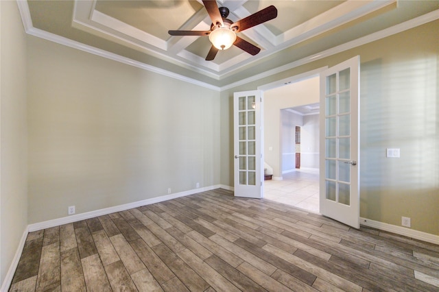 unfurnished room featuring ceiling fan, light wood-type flooring, crown molding, and french doors