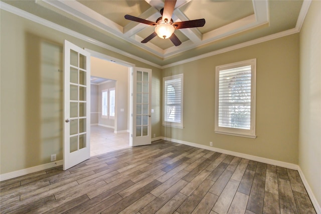 spare room with ceiling fan, french doors, ornamental molding, and light hardwood / wood-style flooring