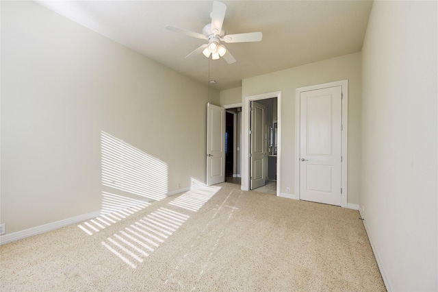 unfurnished bedroom featuring ceiling fan and light colored carpet