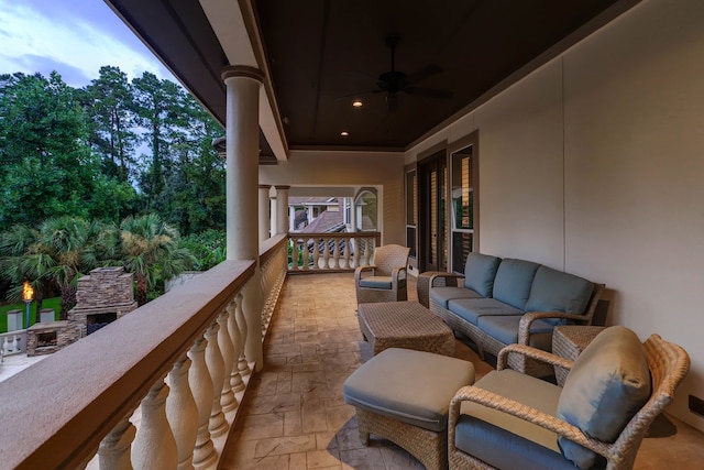 balcony featuring ceiling fan and an outdoor hangout area