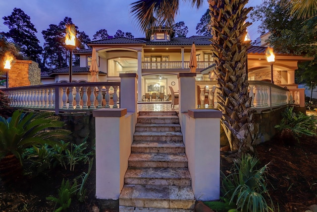 mediterranean / spanish-style home with a balcony