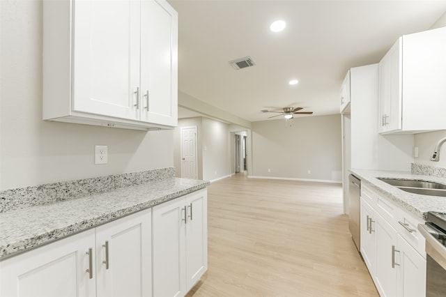 kitchen featuring white cabinetry, light hardwood / wood-style floors, appliances with stainless steel finishes, and sink