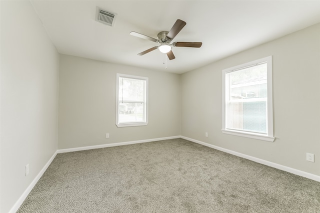 empty room with carpet and ceiling fan