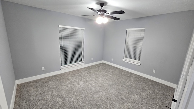 unfurnished room with ceiling fan and carpet floors