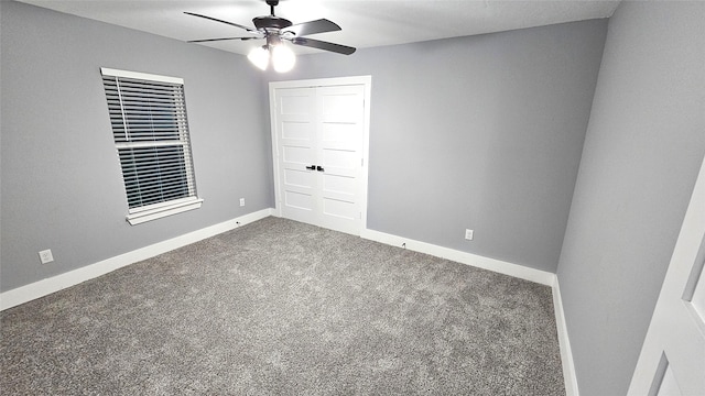 4526 Dixie Dr, Houston, TX 77021 - empty room with a ceiling fan, dark colored carpet, and baseboards