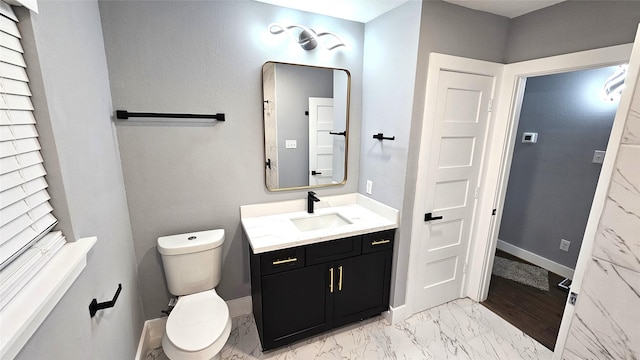 4526 Dixie Dr, Houston, TX 77021 - bathroom with marble finish floors, toilet, and vanity