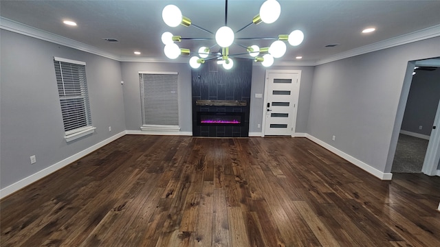 interior space featuring dark wood-type flooring, a chandelier, and crown molding