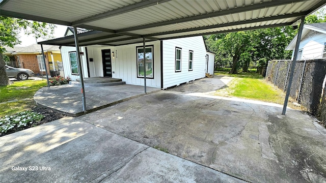 4526 Dixie Dr, Houston, TX 77021 - view of patio featuring fence, a carport, and driveway