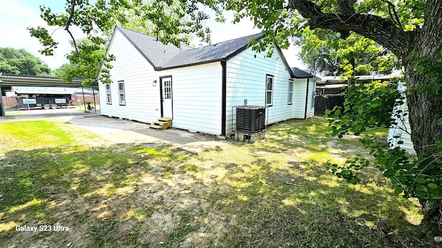 4526 Dixie Dr, Houston, TX 77021 - back of house featuring entry steps, cooling unit, a shingled roof, and fence