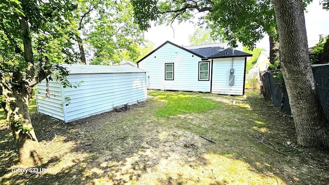 4526 Dixie Dr, Houston, TX 77021 - back of house featuring fence, an outdoor structure, and a storage unit