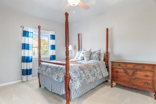 bedroom featuring light carpet and ceiling fan