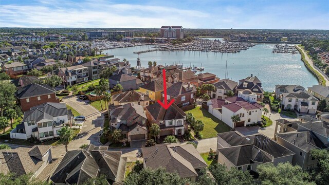 birds eye view of property with a water view