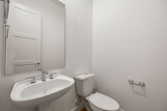 bathroom with toilet and sink