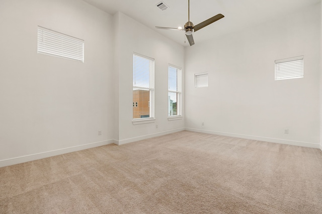 empty room with light carpet and ceiling fan