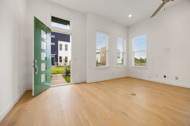 unfurnished room with light hardwood / wood-style floors and ceiling fan