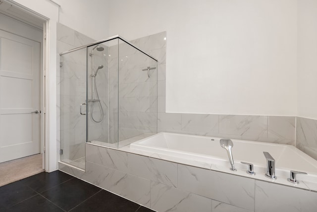 bathroom featuring plus walk in shower and tile patterned flooring