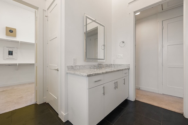 bathroom with vanity and tile patterned floors