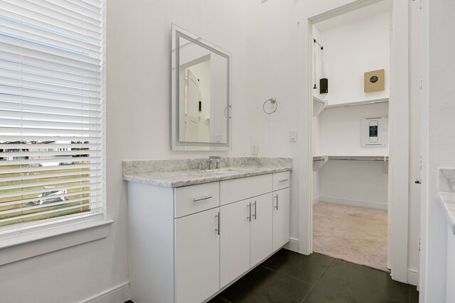 bathroom featuring tile patterned floors and vanity