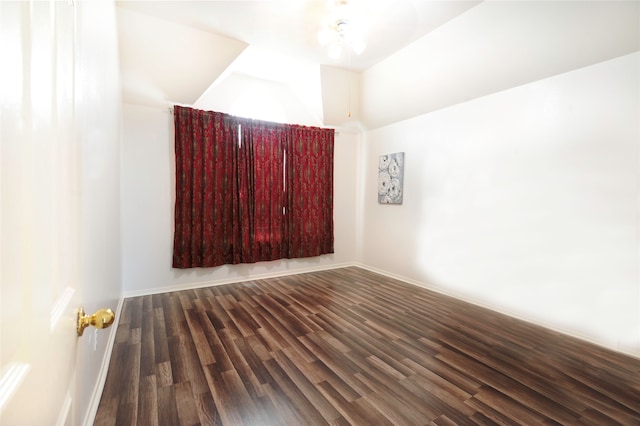 unfurnished room featuring ceiling fan and dark hardwood / wood-style floors