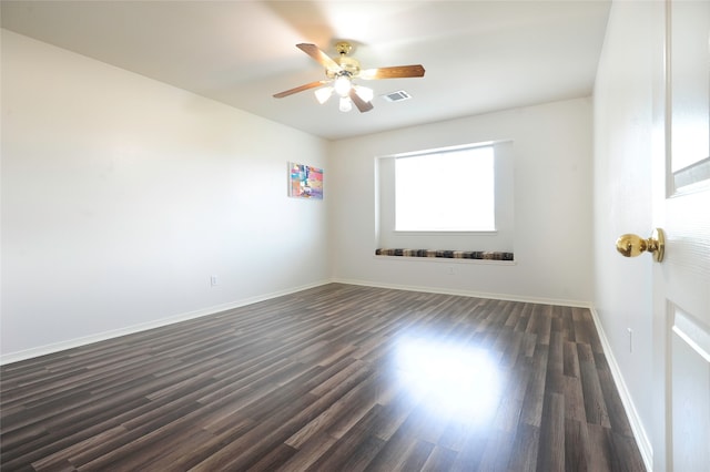 unfurnished room with dark wood-type flooring and ceiling fan