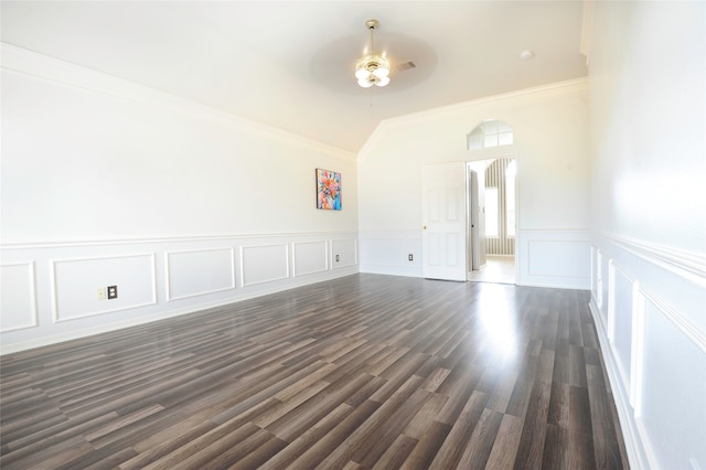 empty room featuring ceiling fan, crown molding, and dark hardwood / wood-style flooring