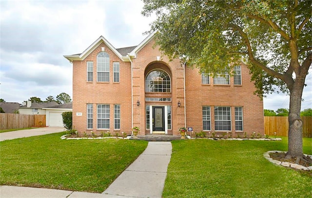 view of front facade featuring a garage and a front lawn