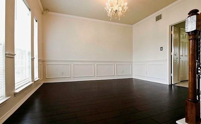 unfurnished room with dark hardwood / wood-style flooring, a chandelier, and crown molding