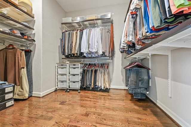 spacious closet featuring hardwood / wood-style flooring