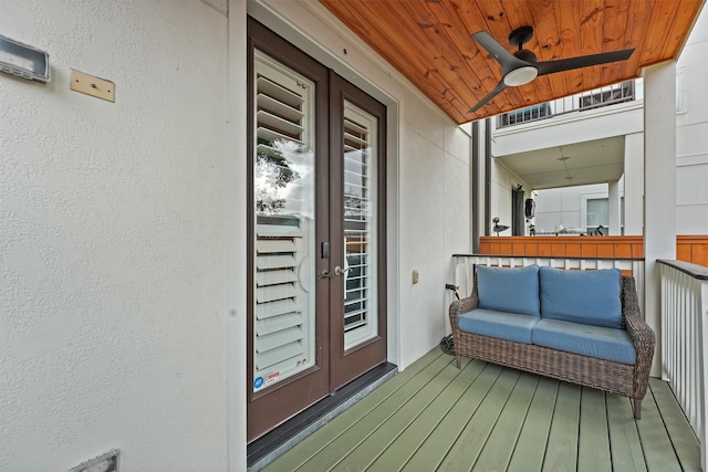 deck with ceiling fan and french doors