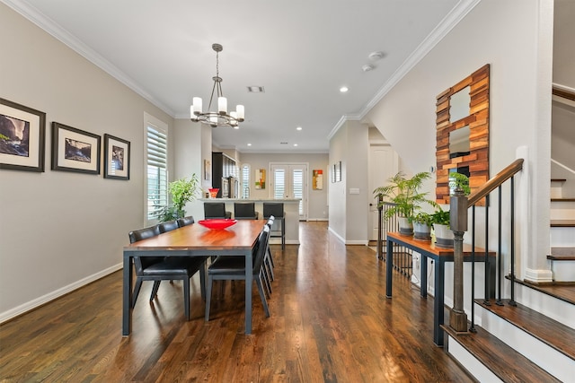 dining space with ornamental molding, dark hardwood / wood-style flooring, and a chandelier