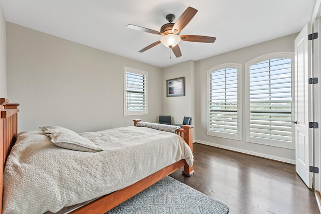 bedroom featuring dark wood-type flooring and ceiling fan