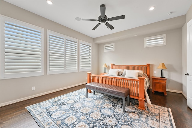 bedroom with ceiling fan and dark hardwood / wood-style floors