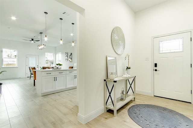 entryway featuring ceiling fan