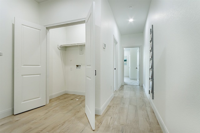 hall with light hardwood / wood-style flooring