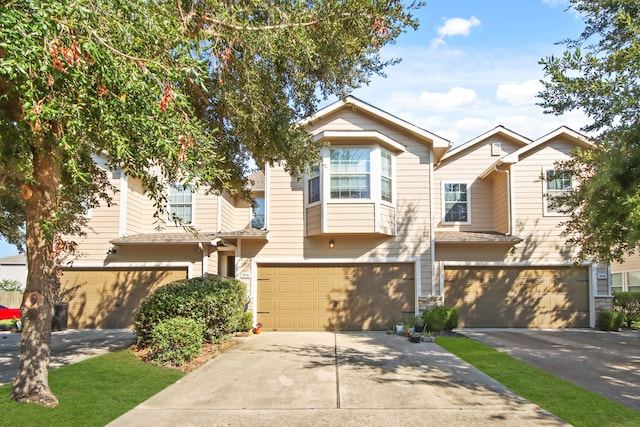 multi unit property featuring a garage