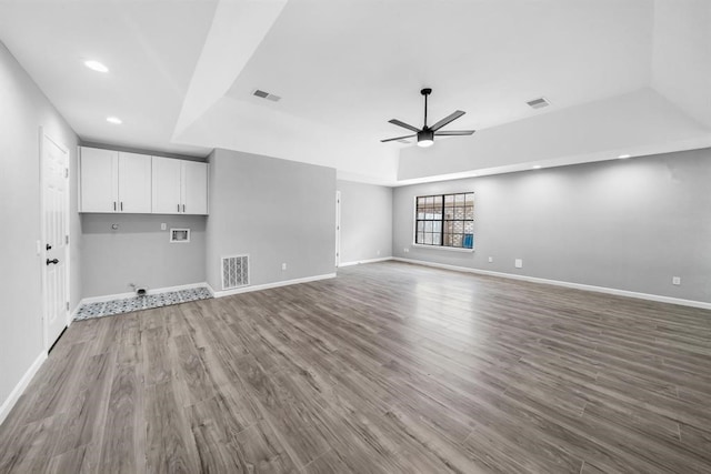 interior space with hardwood / wood-style floors and ceiling fan