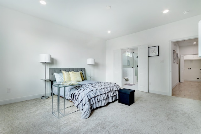 carpeted bedroom with ensuite bathroom