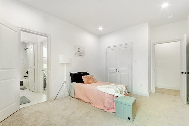 carpeted bedroom featuring a closet