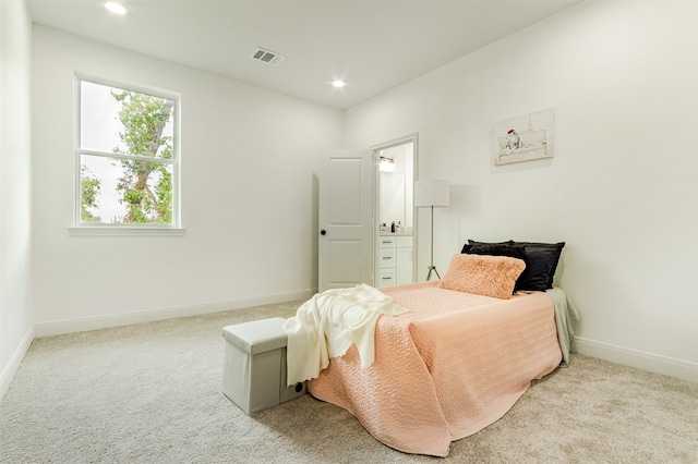 bedroom featuring light colored carpet