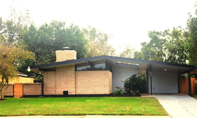 exterior space with a carport and a front yard